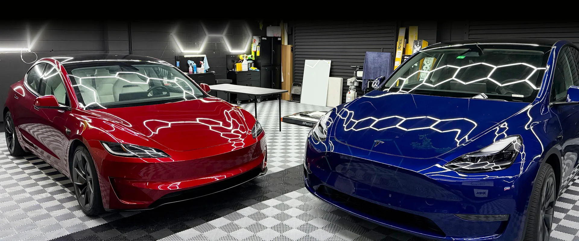 Red and blue Tesla Model 3 pair in studio